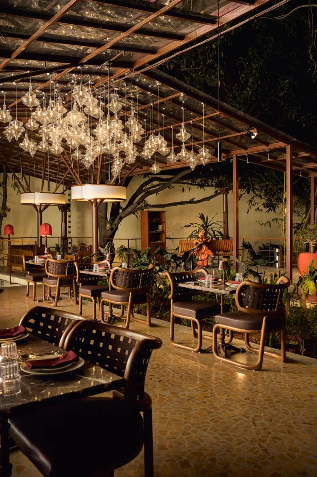 Grand dining room with warm pendant lighting and timber accents